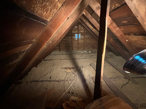 Basement spray foam installation, providing airtight and efficient insulation.
