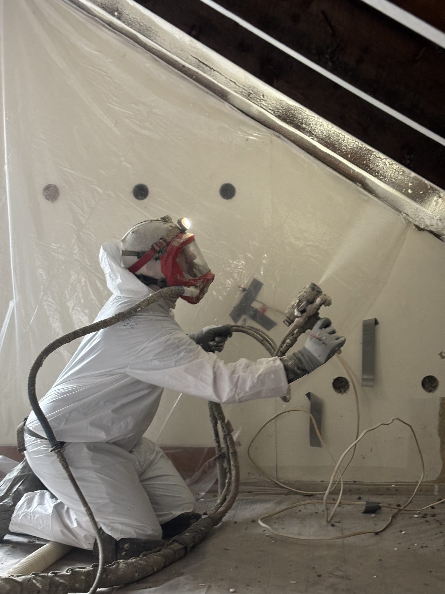 Crawl space insulation installation, improving energy efficiency and moisture control.